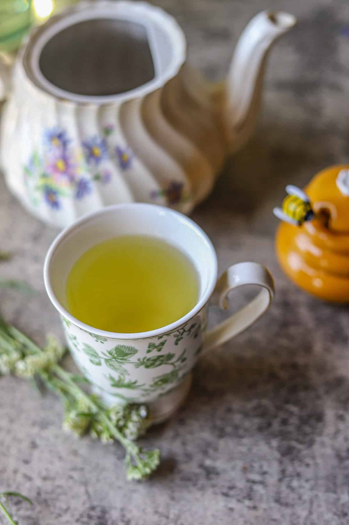 yarrow tea with a tea pot and honey.
