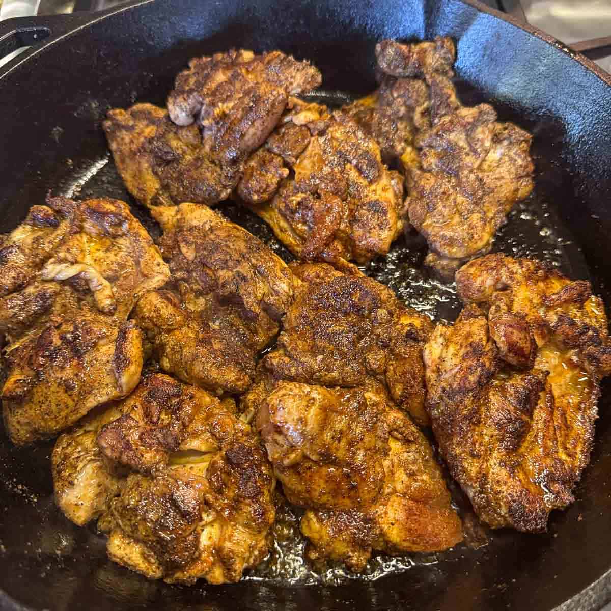 chicken thighs in a pan.