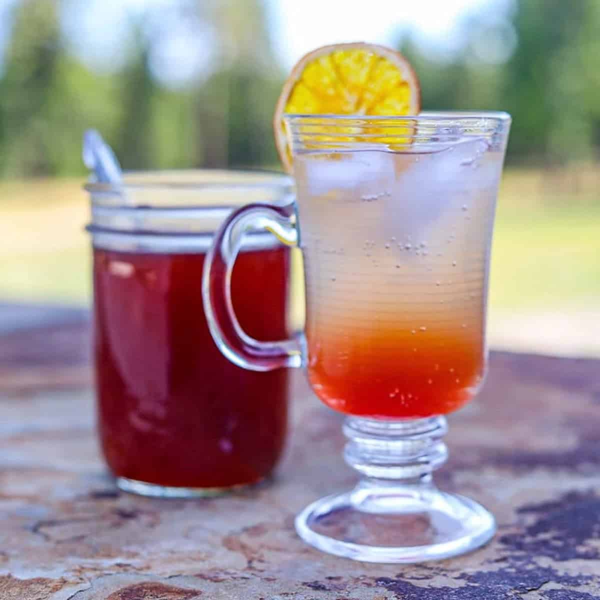 elderberry shrub in a jar and glass.