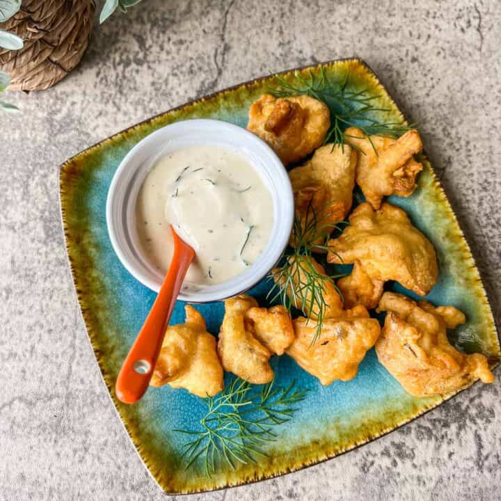 vegan fried chicken with ranch dressing on a blue plate
