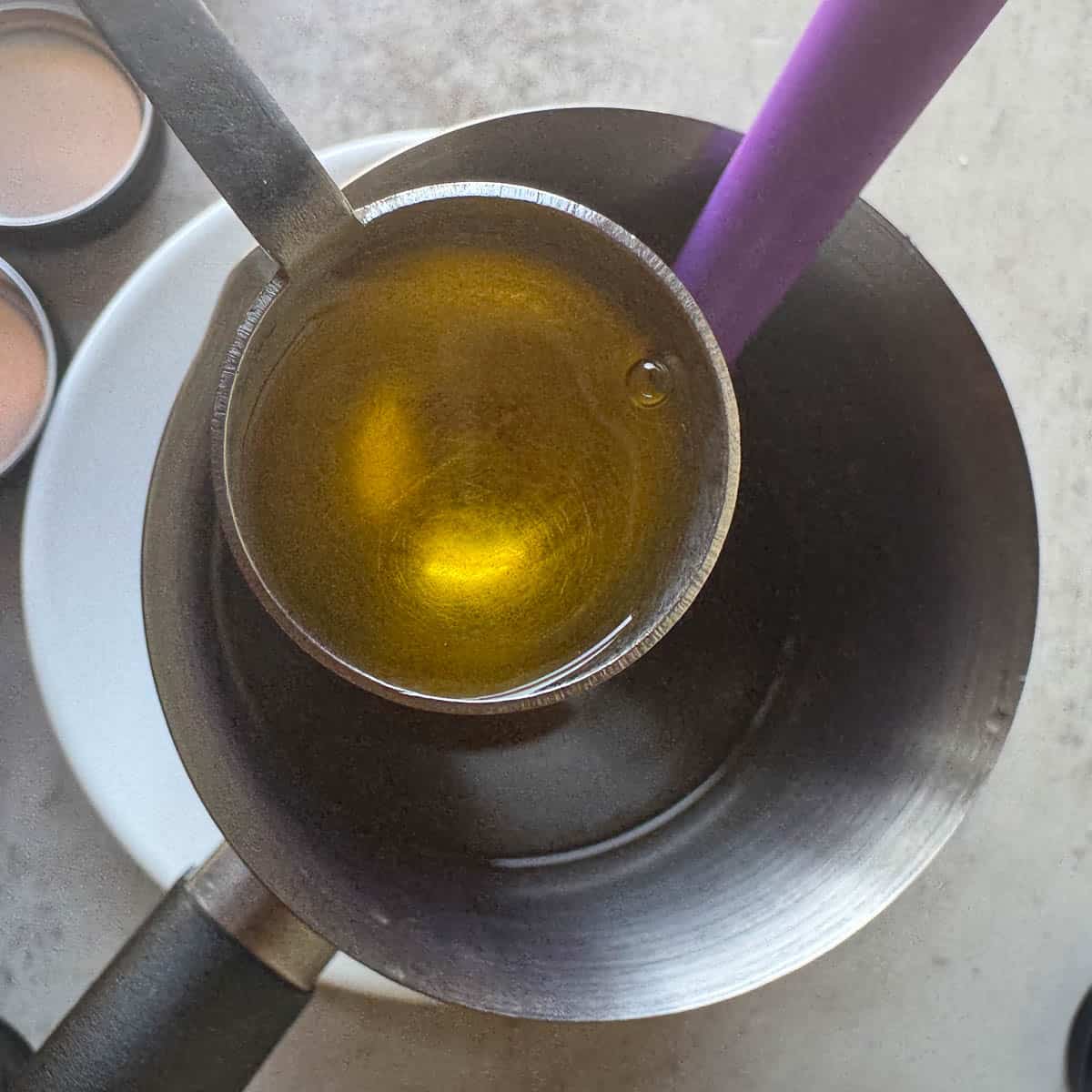 adding vitamin E to a saucepan