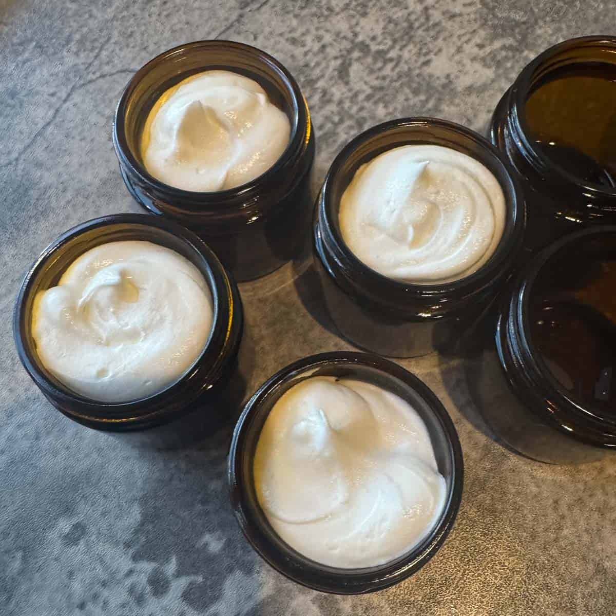 whipped tallow balm in amber jars