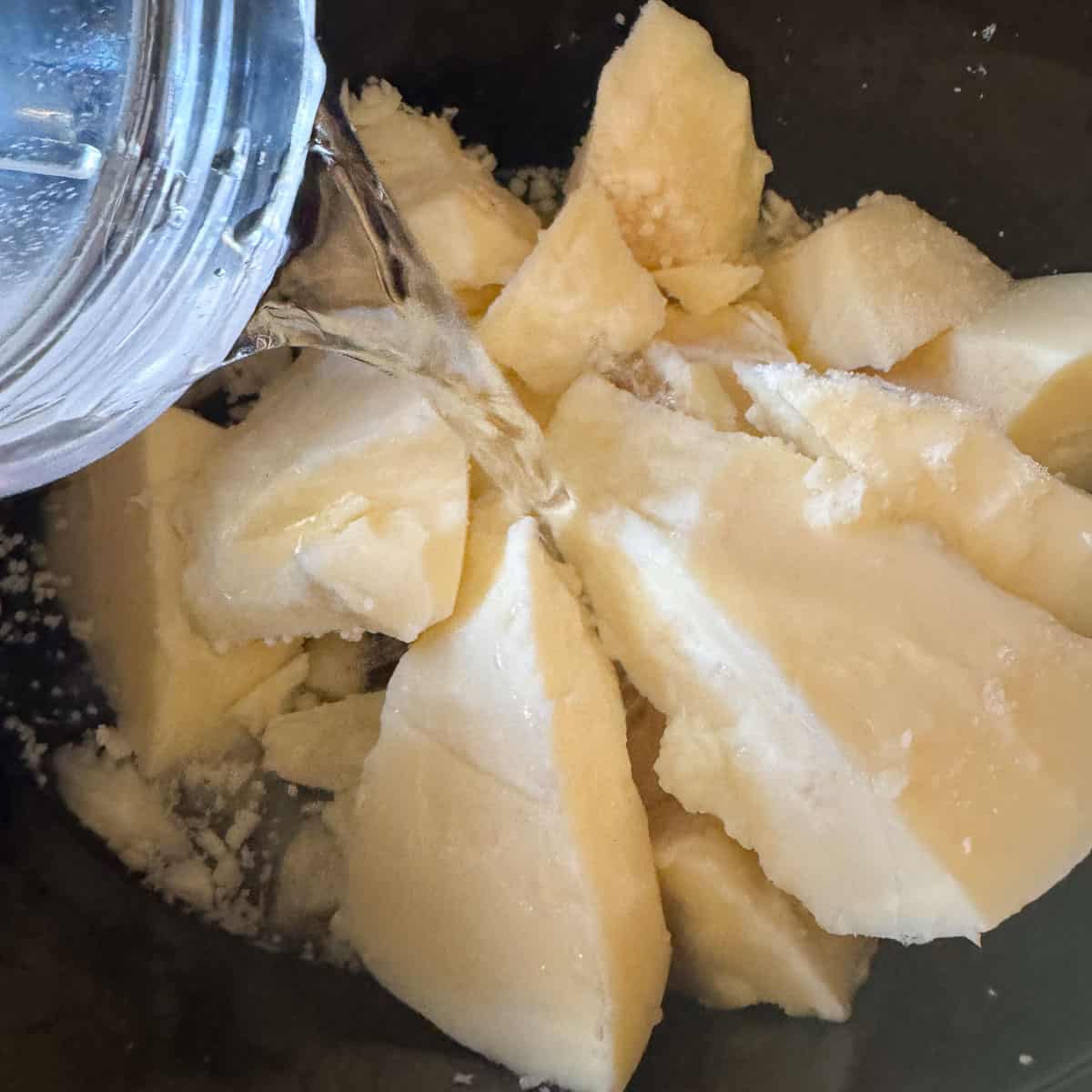 pouring water over fat chunks