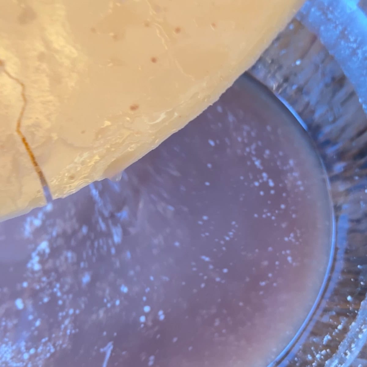 removing fat puck from a bowl of water with impurities