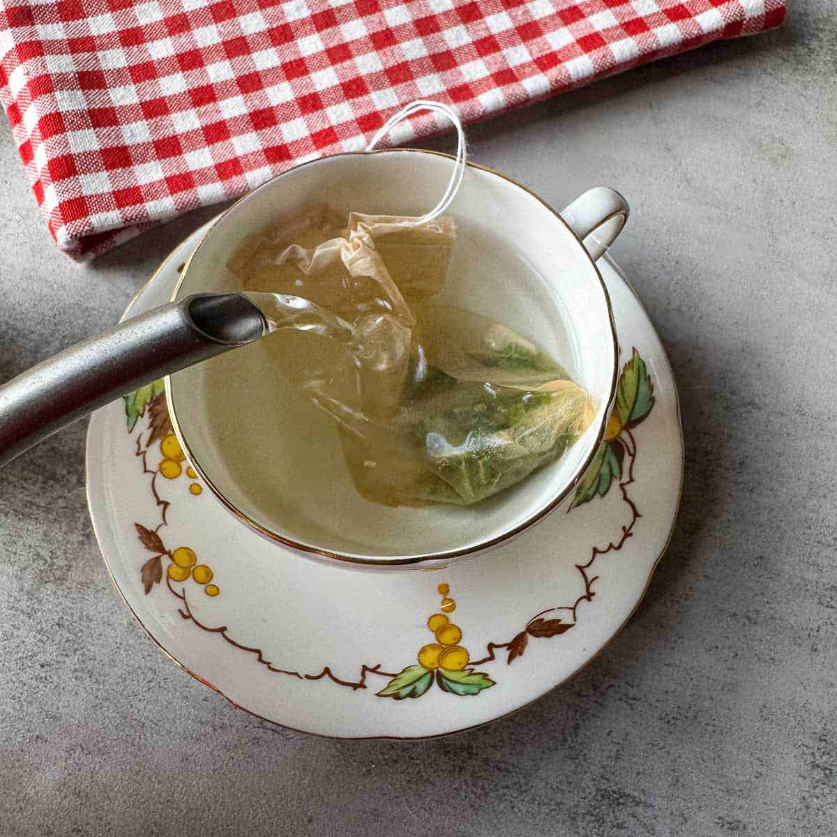 pouring hot water over a mullein tea bag