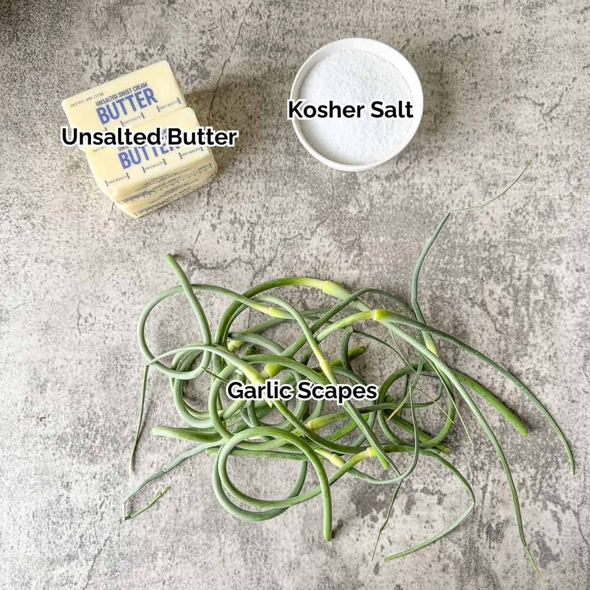 garlic scape butter ingredients including garlic scapes, salt, and butter