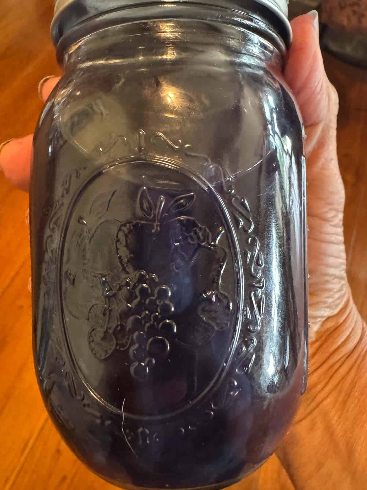 purple ghost pipe tincture in a mason jar