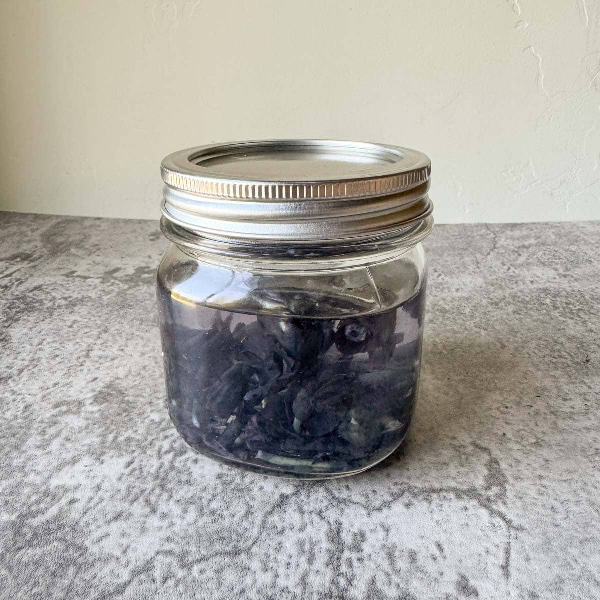 ghost pipe in jar of alcohol