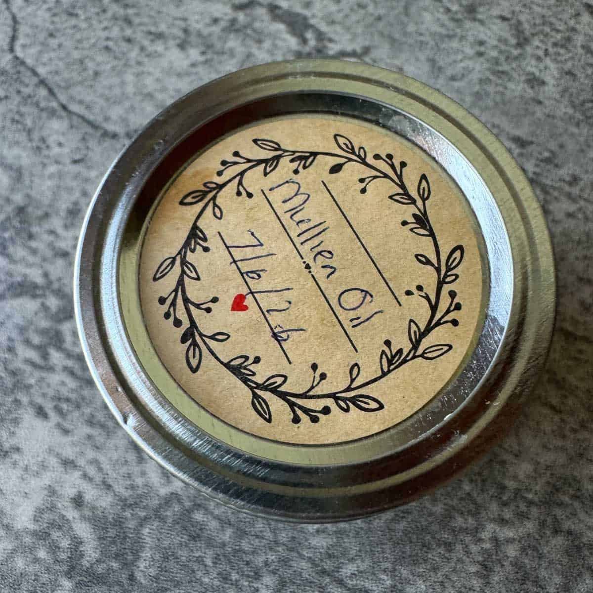 a small jar labeled with mullein oil and date