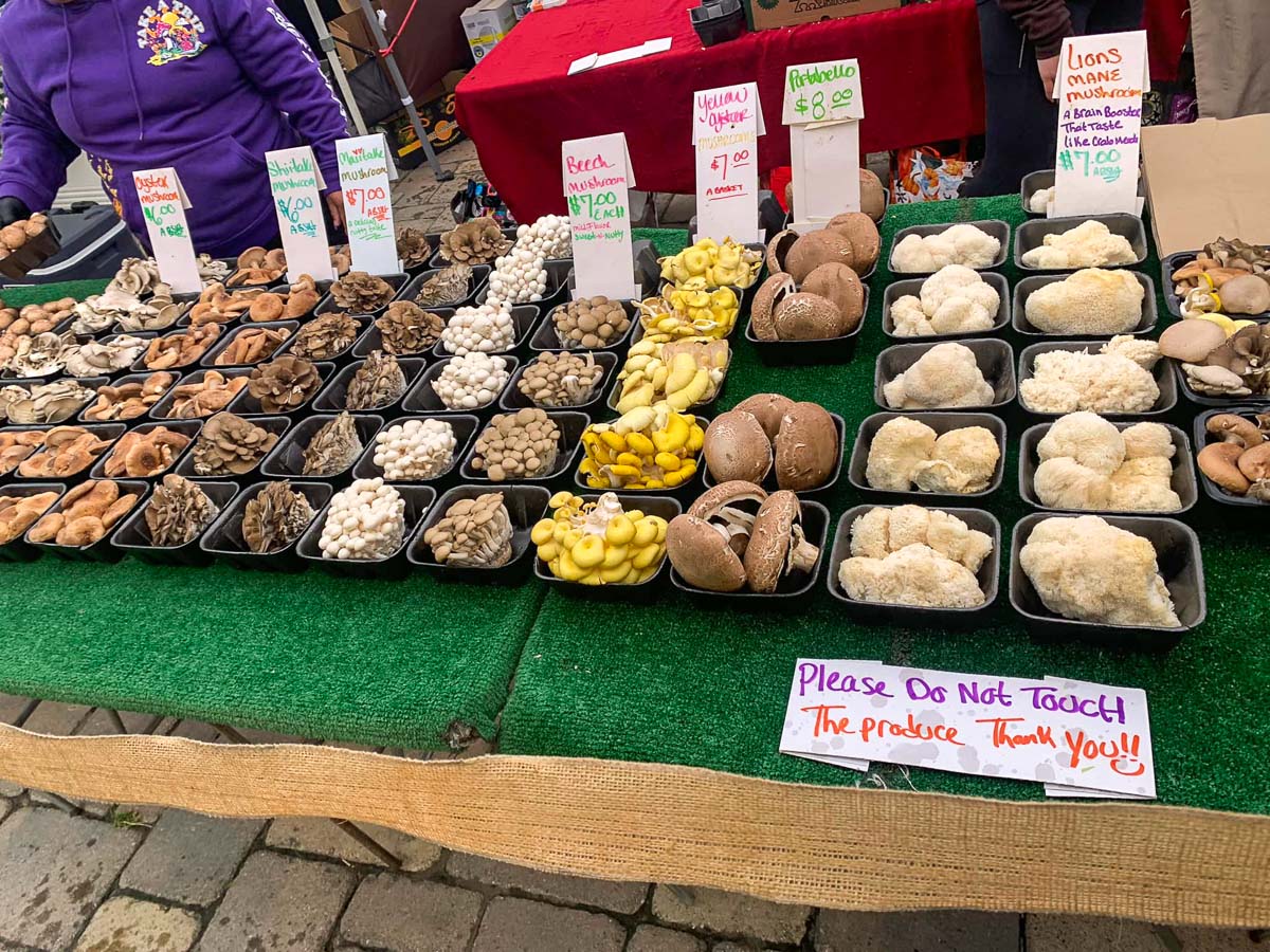 mushrooms being sold at a farmer's market
