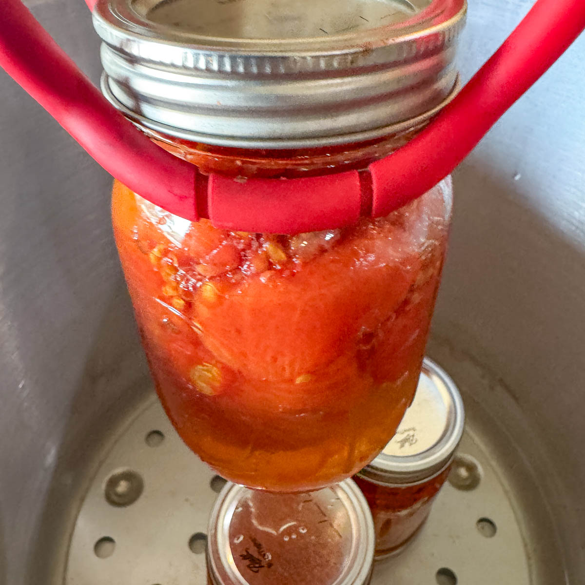 removing pressure canned tomatoes from pressure canner