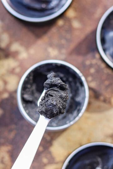 black drawing salve in tins