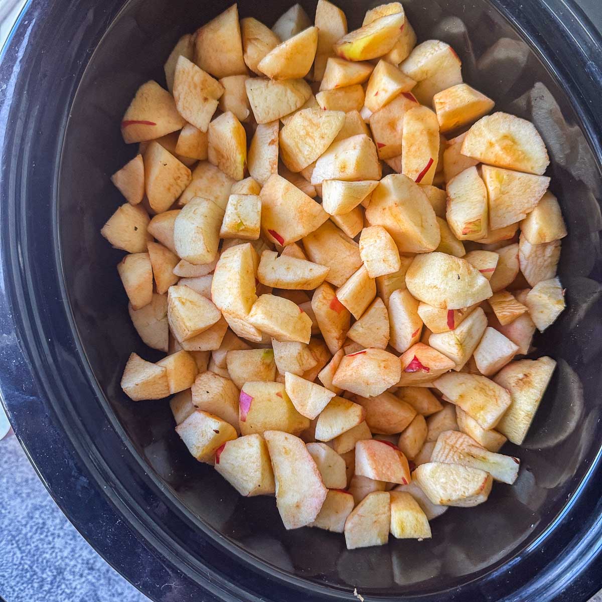 chopped apples in a slow cooker
